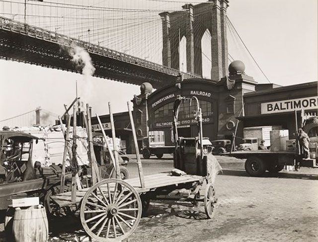 March 30, 1937 âÂ The pier shed of the Pennsylvania and B & O Railroads at Pier 21 with the Brooklyn Bridge and the Manhattan Bridge in the background, taken from South Street between Peck Slip and Dover Street.